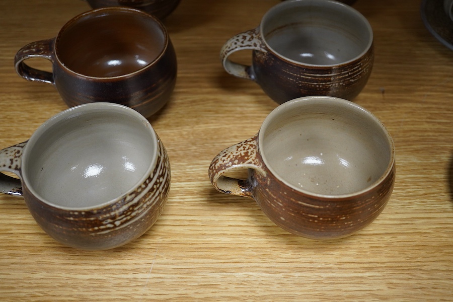 Guy Sydenham (1916-2005), two studio pottery cups and saucers, together with six teacups, incised marks, largest 13.5cm in diameter